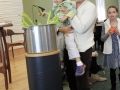 Putting vegetables in the Stone Soup pot.