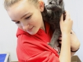 Youth interacting with cat.